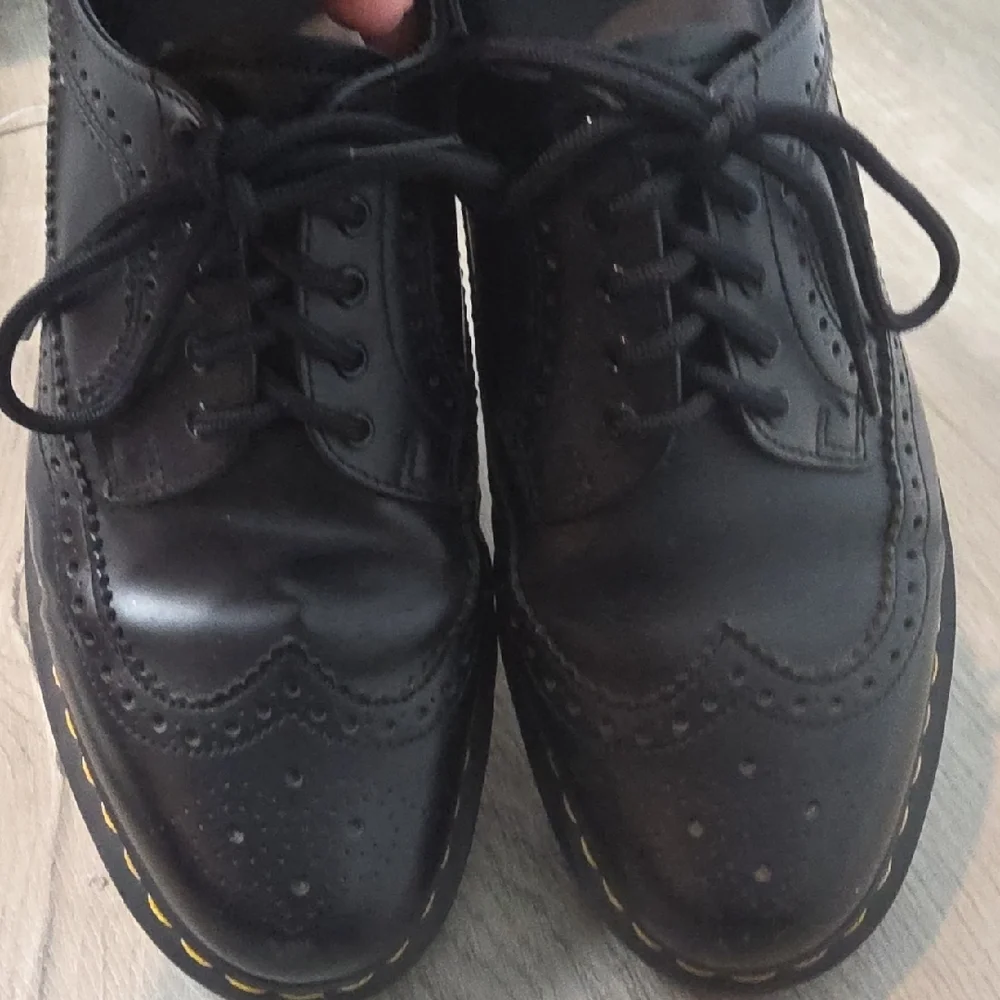Dr. Martens Black Leather Wingtip Oxfords with Yellow Stitching